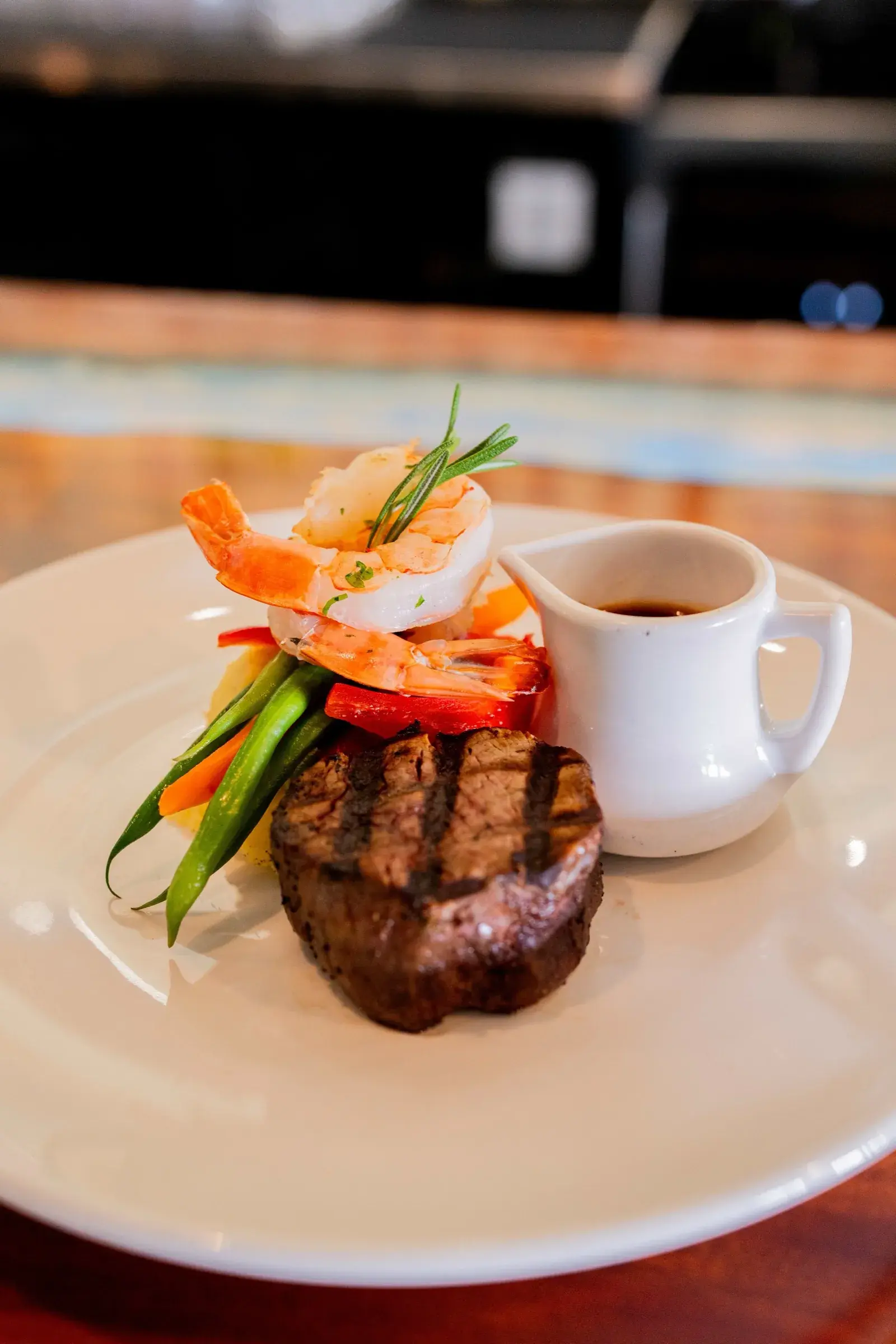 Grilled filet mignon with shrimp and seasonal vegetables at Jackie Rey's Kona.